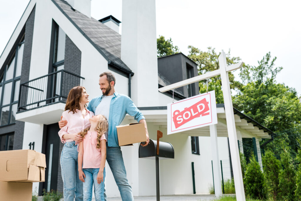 Family outside their new home